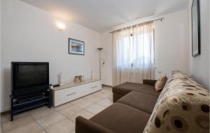 Telewizja i/lub zestaw kina domowego w obiekcie Holiday Home Vrsar 38
