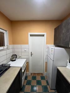 Kuchyň nebo kuchyňský kout v ubytování Square Vanilla Apartments