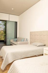 a bedroom with two beds and a couch at New Santa Fe Home Private Relaxation Realm in Xochitepec