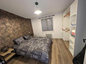 Katil atau katil-katil dalam bilik di Magnifique appartement Mimizan