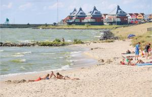 a group of people laying on the sand at the beach at Wachter in Stavoren