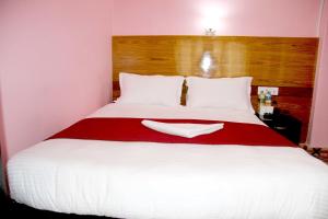 Katil atau katil-katil dalam bilik di Hotel Buttercup