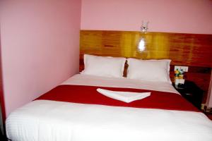 Katil atau katil-katil dalam bilik di Hotel Buttercup
