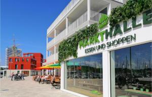 a store front of a building with a large window at Dünenvilla 18, Whg 8 in Travemünde +18 photos