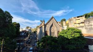 an old church on the side of a city street at Casa Laranja in Rio de Janeiro +36 photos