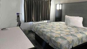 Ένα ή περισσότερα κρεβάτια σε δωμάτιο στο Motel 6-Meridian, MS