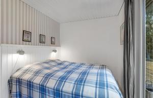 Postel nebo postele na pokoji v ubytování Holiday Home Jomfrustien Nexø I