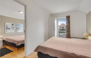 Katil atau katil-katil dalam bilik di Cozy Apartment In Rudkøbing With Wifi