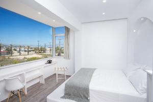 Ένα ή περισσότερα κρεβάτια σε δωμάτιο στο Ammos Junior Suite - in der Nähe des Strandes von Faliraki