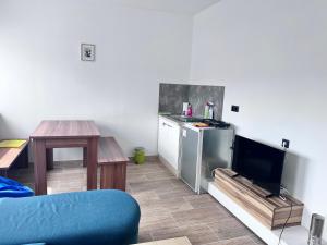 TV a/nebo společenská místnost v ubytování TOP 2 Geräumiges 2 Zimmer Apartment für bis zu 6 Personen