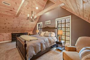 a bedroom with a large bed in a room with wooden ceilings at Twin Björn in Sugar Mountain