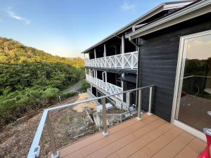 a balcony with a view of a house at Peace INN HAGI in Hagi