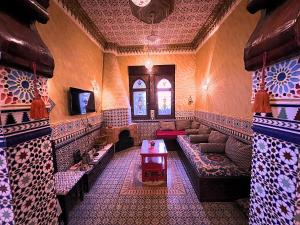 a living room with a couch and a table in a room at Villa Barba Luxor in Luxor