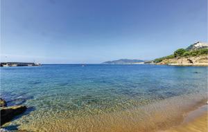 a large body of water next to a beach at Gorgeous Apartment In Castellabate Sa in Castellabate