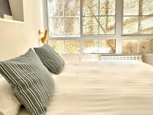 En eller flere senge i et værelse på Alojamiento acogedor