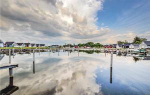 a large body of water with houses and a cloudy at Lovely Home In Zerpenschleuse With Wifi in Zerpenschleuse