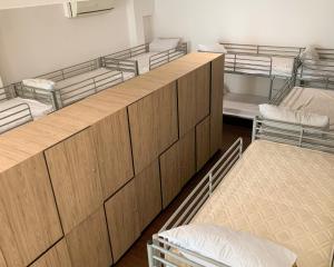 a room with four bunk beds in a room at Betel Box Backpackers Hostel in Singapore