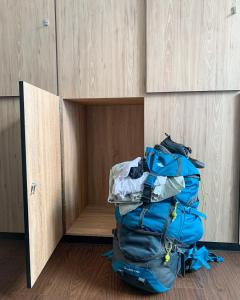 a pile of luggage sitting on the floor in a room at Betel Box Backpackers Hostel in Singapore