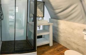 a bathroom with a sink and a mirror at Amazing StaCaravan In Hoogersmilde in Hoogersmilde