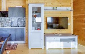 a kitchen with white cabinets and a counter at Awesome Home In Merzalben With Wi-Fi in Merzalben