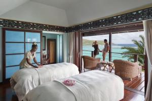 Llit o llits en una habitació de Mandarin Oriental, Canouan