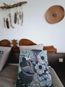 a bedroom with a bed with a pillow and some antlers at Suite 4 pers dans village vacances in Sainte-Anne