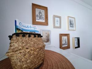 a room with a wall with pictures on it at Suite 4 pers dans village vacances in Sainte-Anne