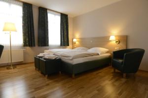 Postel nebo postele na pokoji v ubytování Apartment Hotel Rüther + 13 fotografií