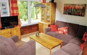 a living room with two couches and a television at Ferienhaus 72 In Frankenau in Frankenau