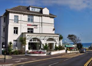 a white building on the side of a street at Park Central Hotel in Bournemouth