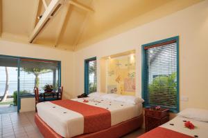 Postel nebo postele na pokoji v ubytování Fiji Hideaway Resort & Spa + 37 fotografií