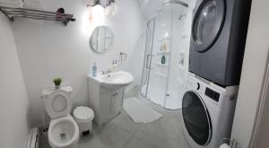 a bathroom with a toilet and a shower and a sink at Room in Halifax - Studio Suite in Halifax +14 photos