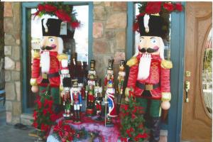 two nutcrackers are standing in front of a door at Mountain Breeze Motel in Pigeon Forge