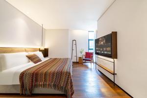 Wuyu Hotel - Chongqing Jiangbei Airport & Light Rail客房内的一张或多张床位