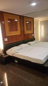 Postel nebo postele na pokoji v ubytování Bermuda Hotel
