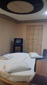 Postel nebo postele na pokoji v ubytování Bermuda Hotel