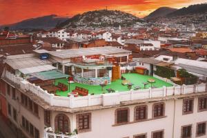 an aerial view of a city with a building at Vibes Aurik in Quito