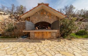 a kitchen in a stone building with a counter at Lovely Apartment In Ribarica - Karlobag in Matić Podi +12 photos