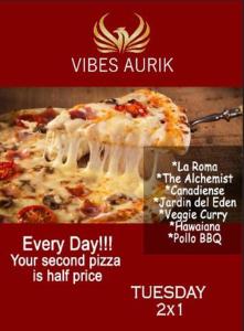 a poster for a pizzeria with a slice of pizza at Vibes Aurik in Quito