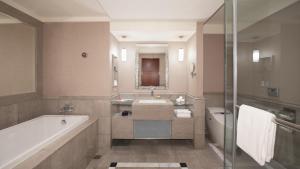 a bathroom with a tub and a sink and a toilet at Hamp Court Palace Taipei in Taipei +34 photos