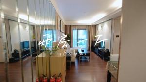 TV i/ili zabavni centar u objektu Shenzhen Binhe Impression Hotel Apartments