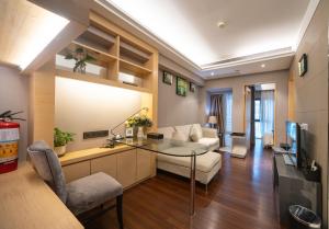 TV i/ili zabavni centar u objektu Shenzhen Binhe Impression Hotel Apartments
