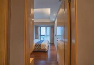 Krevet ili kreveti u jedinici u objektu Shenzhen Binhe Impression Hotel Apartments