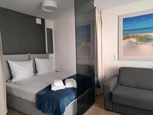 Posteľ alebo postele v izbe v ubytovaní MK Apartamenty Morski