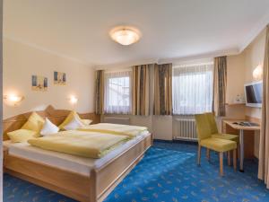 Łóżko lub łóżka w pokoju w obiekcie Zeitlos Apartments - Gerlos