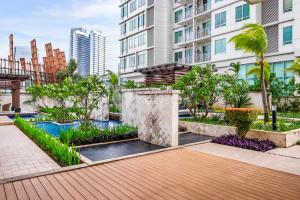 a courtyard with a pool in a building at Sattva by Kozystay - Kuningan in Jakarta