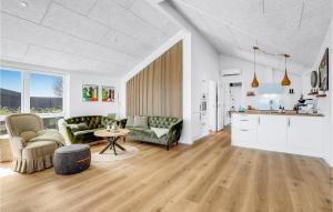 a living room with a couch and a table at Beautiful Home In Hejls With Wifi in Hejls
