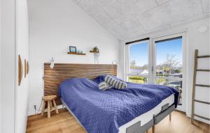 a bedroom with a bed and a large window at Beautiful Home In Hejls With Wifi in Hejls +18 photos