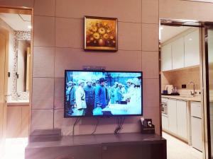 TV i/ili zabavni centar u objektu Shenzhen Binhe Impression Hotel Apartments