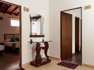 Postel nebo postele na pokoji v ubytování Hotel Casa Suite Curiti